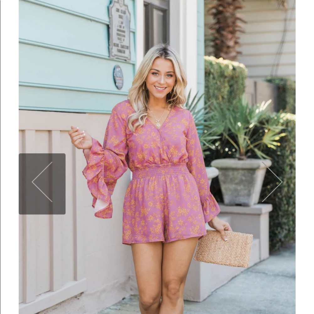 Never worn romper. Picture of the model included from their website.
